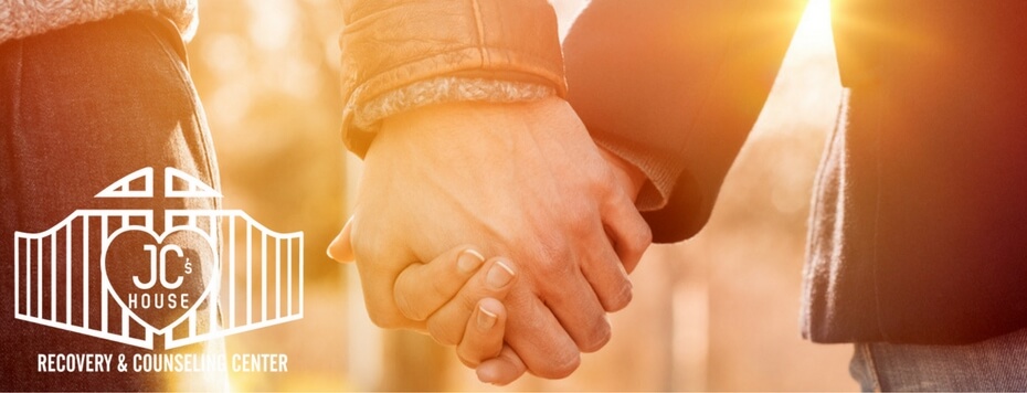 support-recovery-closeup-of-loving-couple-holding-hands-while-walking-at-sunset-jcblog2